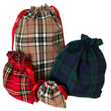 A collection of four fabric gift bags with a checkered pattern, in various sizes, displayed on a white  background.