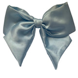 A baby blue satin hair bow clip displayed on a white background, with a silver-colored barrette clip attached.