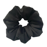 Black scrunchie on a white background