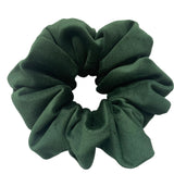 Green scrunchie on a white background