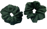 Two green scrunchies on a white background