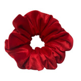 Red velvet scrunchie on a white background
