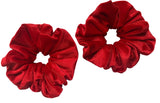 Two red scrunchies on a white background