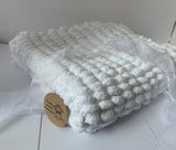 Knitted baby blanket.