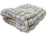Beige baby blanket.