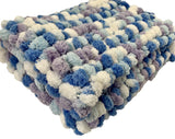 Knitted baby blanket.