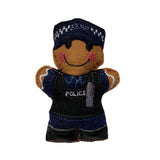 Police officer gingerbread decoration in navy blue uniform and stab vest, on white background.