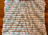 Knitted baby blanket.