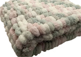Hand knitted, pink grey and white, pom pom wool pram cover.
