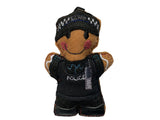 Police officer gingerbread decoration in black uniform stab vest, on white background.