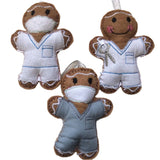 Three gingerbread man decorations in dentist and dental nurse themed outfits, made of felt and designed as Christmas ornaments.