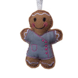 Beautician felt gingerbread decoration. Dressed in grey cotton tunic with pink buttons and decorative finish. Lightly filled with a polyester filling to create depth and character. Hand sewn to finish.
