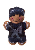 Armed police officer gingerbread decoration  in navy blue uniform.