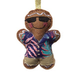 Decorative gingerbread man ornament wearing sunglasses and a colorful shirt on a white background