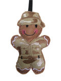 Soldier felt gingerbread decoration. Dressed in a cotton fabric embroidered camouflage uniform and sun hat Lightly filled to create depth and character.