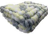 Hand knitted lemon, grey and white, pom pom wool pram cover.
