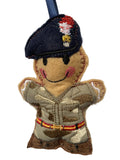 Embroidered felt military mascot ornament in a camouflage uniform with a navy blue beret, shown against a plain white background.