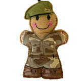 Gingerbread man soldier with a camouflage outfit and green beret on a white background
