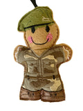 Soldier figurine with camouflage uniform and green beret on a white background