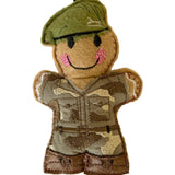 Gingerbread man soldier wearing a camouflage uniform and green beret on a white background