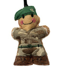 A handmade embroidered fabric soldier ornament with a green beret, camouflage uniform, shown against a plain white background.