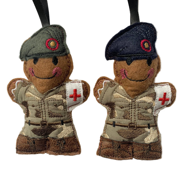 Army medic soldiers in grey and navy berets, gingerbread man decoration.