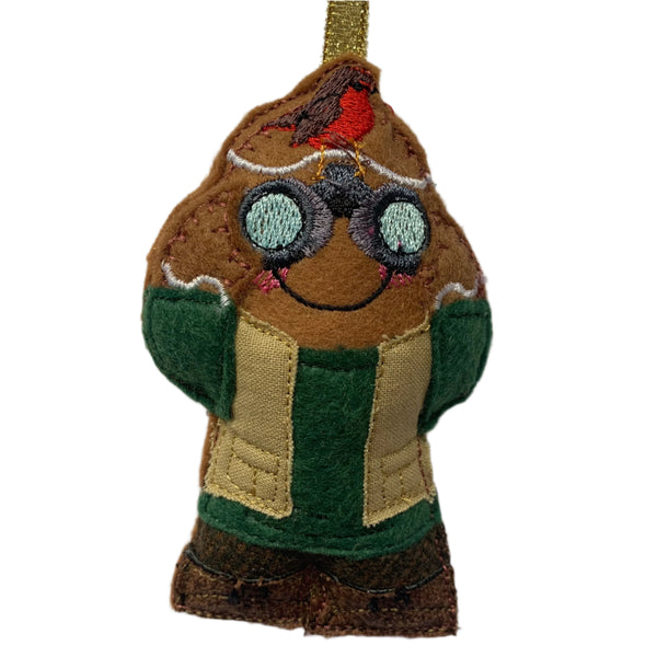 Handmade felt gingerbread man ornament, designed as a bird watcher, with a robin perched on his head and binoculars. For Christmas tree decoration.