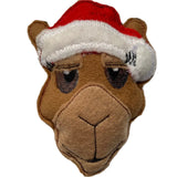 A felt camel Christmas decoration wearing a red and white Santa hat.