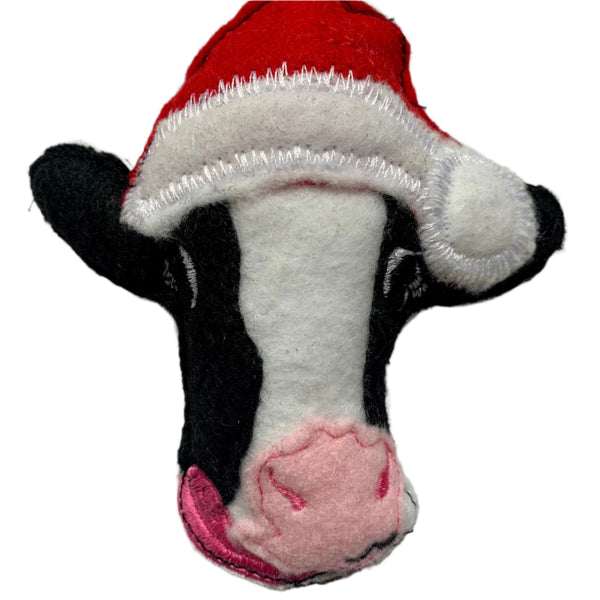 Cow in Christmas hat decoration.
