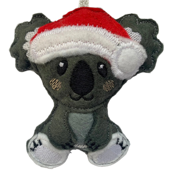 Koala in Santa hat hanging Christmas decoration
