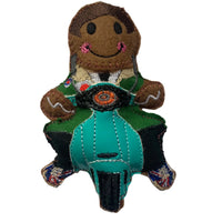 Mod gingerbread man on a scooter decoration with a white background