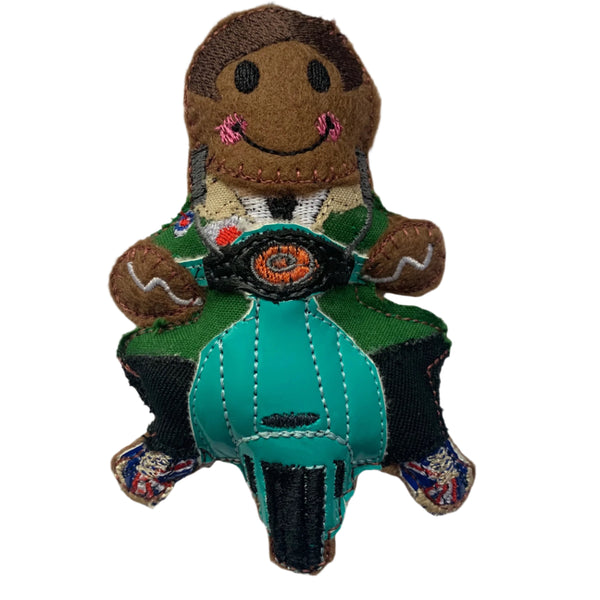 Mod gingerbread man on a scooter decoration with a white background