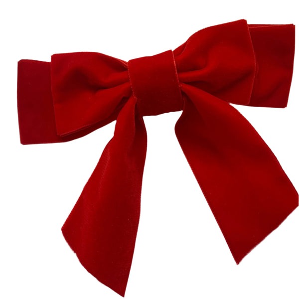 A large red velvet hair bow clip displayed on a white background.