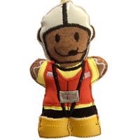 Felt gingerbread man decoration in a scuba fabric yellow coat, red life jacket, black trousers, white hat and yellow vinyl boots. Designed as a lifeboatman, intended for use as a holiday decoration.