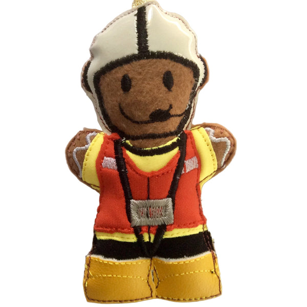 Felt gingerbread man decoration in a scuba fabric yellow coat, red life jacket, black trousers, white hat and yellow vinyl boots. Designed as a lifeboatman, intended for use as a holiday decoration.