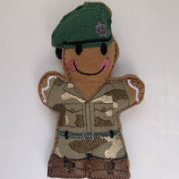 Felt gingerbread soldier decoration in green beret. Embroidered camouflage uniform and brown faux leather boots.