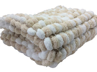 Pram baby blanket cover in neutral shades of beige and white. This chunky knit baby blanket cover is hand knitted in a super soft  pom pom wool.
