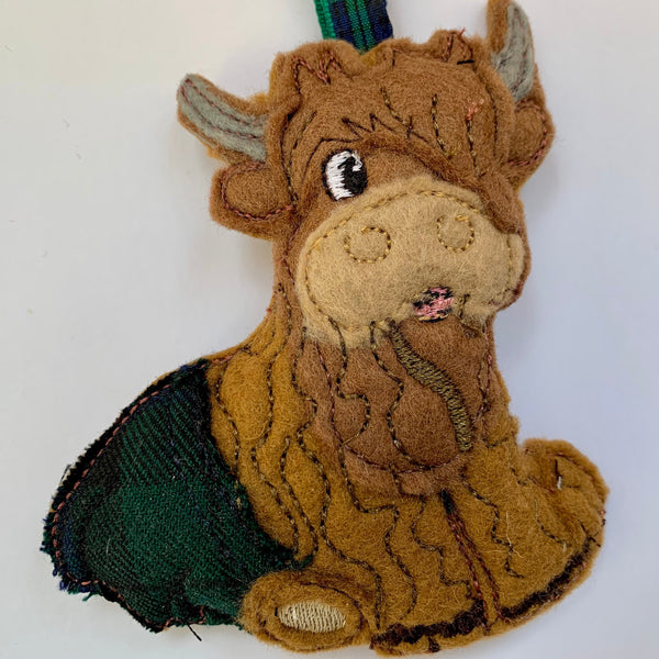 Highland cow machine embroidered felt Christmas Decoration in navy  tartan kilt.