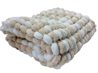 Beige baby blanket.