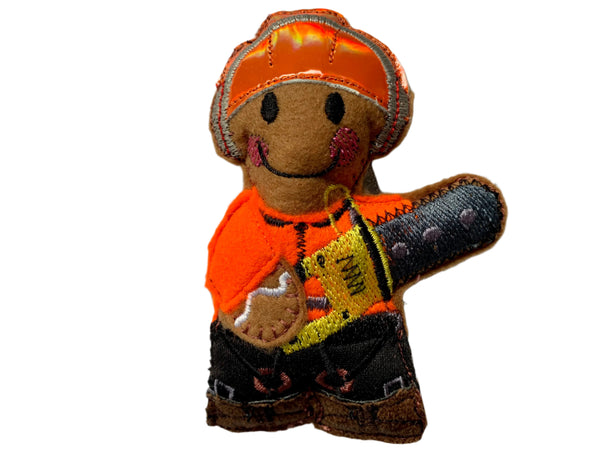 Tree surgeon in safety workwear, gingerbread man decoration.