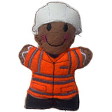A hand-made felt gingerbread man rail worker in orange jacket, black boots and white hat. designed as a Christmas decoration.