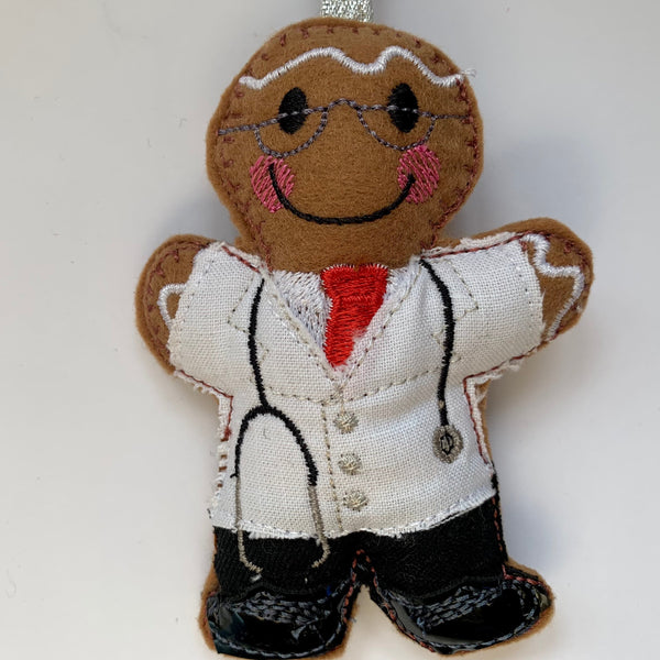 Traditional doctor in white coat, gingerbread man decoration.