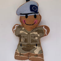 Army Air Corps felt gingerbread decoration. Blue beret, brown faux leather boots and embroidered fabric camouflage uniform.