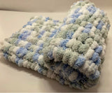 Knitted baby blanket.