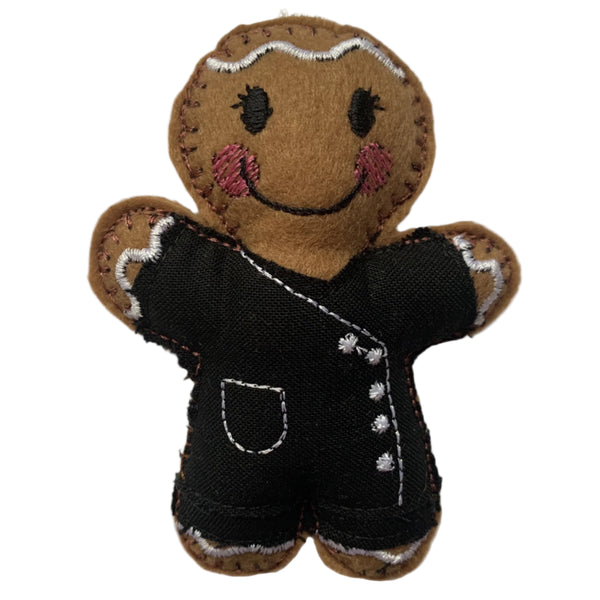 Beautician felt gingerbread decoration. Dressed in black cotton tunic and trousers with white buttons and decorative finish. Lightly filled with a polyester filling to create depth and character. Hand sewn to finish.
