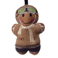 Aviator felt gingerbread decoration. Dressed in a faux leather  flying jacket and hat. Hand finished. On white background.