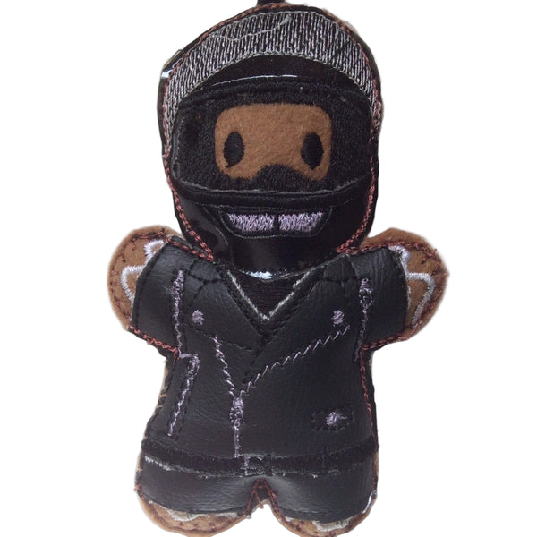Biker gingerbread man Christmas decoration. Dressed in faux leather jacket and trousers., with glossy black full face helmet. On white background.