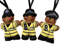 British Transport Police Officer felt gingerbread decorations, showing cap, helmet or female officer decorations on white background.