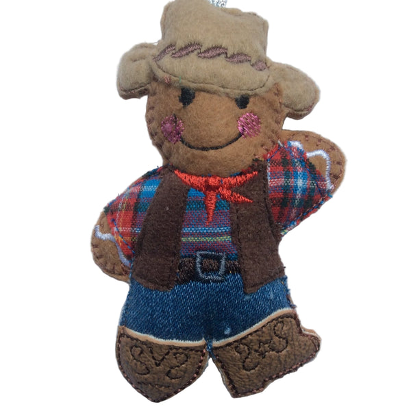 Cowboy/line dancer gingerbread man decoration. Dressed in tartan shirt, blue jeans, brown boots and beige hat.