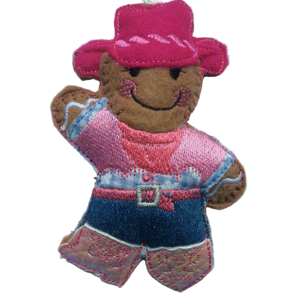 Cowgirl, felt gingerbread Christmas decoration on white background.